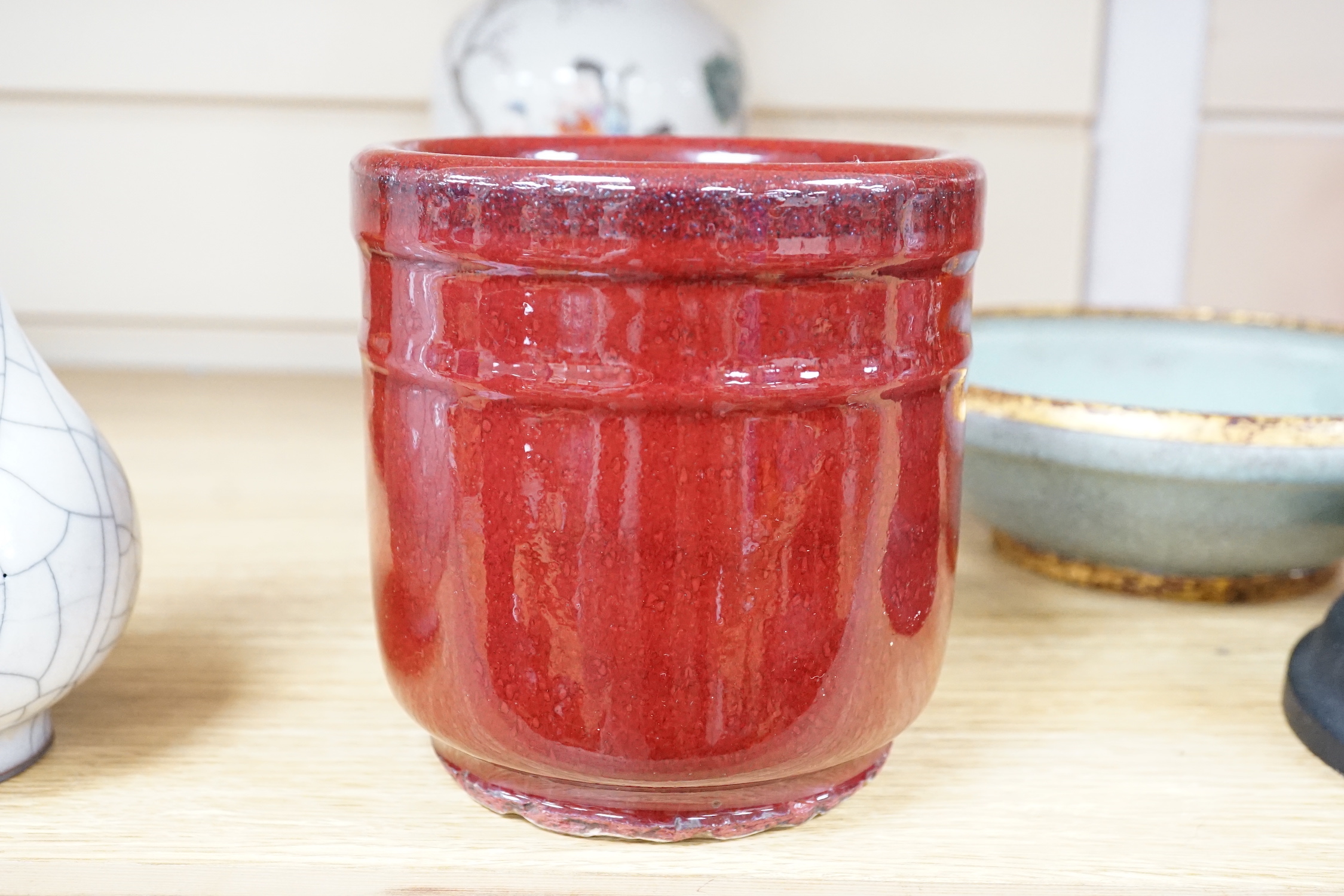 A Chinese famille rose vase, a crackle glaze vase and a sang de boeuf jar, tallest 21.5cm